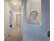 Hallway with carpet and decorative bust in an alcove at 3534 Brandywine Nw Rd, Kennesaw, GA 30144