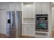 Modern kitchen featuring stainless steel appliances and white cabinetry providing great space at 3534 Brandywine Nw Rd, Kennesaw, GA 30144