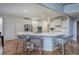 Bright kitchen with a large center island, stainless steel appliances, and hardwood floors at 3534 Brandywine Nw Rd, Kennesaw, GA 30144