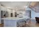 Modern kitchen with a large quartz island, stainless steel appliances, and seating for casual dining at 3534 Brandywine Nw Rd, Kennesaw, GA 30144