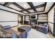 Cozy basement living area with a fireplace, built-in shelving, and comfortable seating with a leather sofa at 3534 Brandywine Nw Rd, Kennesaw, GA 30144