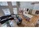 Upstairs view of the living room, open kitchen, and dining area, highlighting the home's layout at 3534 Brandywine Nw Rd, Kennesaw, GA 30144