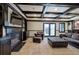 Finished basement with dark trim, built-in shelves, fireplace, and sliding doors leading to the yard at 3534 Brandywine Nw Rd, Kennesaw, GA 30144