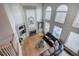 Two-story living room with large windows, a fireplace, and hardwood floors at 3534 Brandywine Nw Rd, Kennesaw, GA 30144