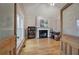 Cozy living room through vintage 'Smoke Room' doors, complete with fireplace and built-in bookcase, offering a comfortable retreat at 3534 Brandywine Nw Rd, Kennesaw, GA 30144