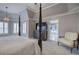 Bright main bedroom with a four-poster bed, lots of natural light, and a view to the ensuite at 3534 Brandywine Nw Rd, Kennesaw, GA 30144