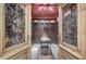 View inside the wine cellar featuring a custom wine rack, stone floors, and a small center table at 3534 Brandywine Nw Rd, Kennesaw, GA 30144
