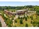 Aerial view of a modern structure with a rooftop garden overlooking a park and green space at 383 Pratt Se Dr # 503, Atlanta, GA 30315