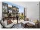 Relax on this private balcony with stylish furniture and views of the community at 383 Pratt Se Dr # 503, Atlanta, GA 30315