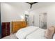Bright bedroom with view to bathroom and kitchen beyond, plus two dressers and ceiling fan at 383 Pratt Se Dr # 503, Atlanta, GA 30315