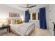 Cozy bedroom with a bed, bedside tables, and colorful curtains at 383 Pratt Se Dr # 503, Atlanta, GA 30315