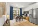 Charming dining area with table, natural light, and balcony access, next to a stainless steel refrigerator at 383 Pratt Se Dr # 503, Atlanta, GA 30315