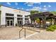Inviting restaurant exterior featuring a covered patio with a stone walkway and lush landscaping at 383 Pratt Se Dr # 503, Atlanta, GA 30315