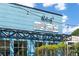 Vibrant blue building featuring multiple businesses, each with unique offerings and signage at 383 Pratt Se Dr # 503, Atlanta, GA 30315