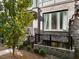 Modern brick building with large windows, black railings, and lush landscaping at 383 Pratt Se Dr # 503, Atlanta, GA 30315