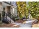 Beautiful brick townhome featuring a well-manicured yard and inviting entrance staircase at 383 Pratt Se Dr # 503, Atlanta, GA 30315