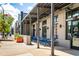 Commercial building featuring a covered outdoor seating area with blue tables and chairs at 383 Pratt Se Dr # 503, Atlanta, GA 30315