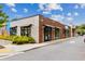 Commercial building with brick and white facade, featuring multiple storefronts and awnings at 383 Pratt Se Dr # 503, Atlanta, GA 30315