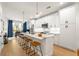 Modern open concept kitchen featuring quartz countertops, stainless appliances, and a large island at 383 Pratt Se Dr # 503, Atlanta, GA 30315
