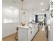Bright, modern kitchen with white cabinets, quartz countertops, and stainless steel appliances at 383 Pratt Se Dr # 503, Atlanta, GA 30315