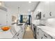 Sleek modern kitchen featuring quartz countertops, stainless appliances, and a breakfast bar at 383 Pratt Se Dr # 503, Atlanta, GA 30315
