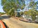 Dirt path in a development with new landscaping, native trees and building in background at 383 Pratt Se Dr # 503, Atlanta, GA 30315
