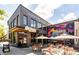 Outdoor patio with seating, umbrellas, and views of the adjacent commercial buildings at 383 Pratt Se Dr # 503, Atlanta, GA 30315