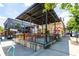 Vibrant outdoor patio with colorful seating and overhead covering, adjacent to commercial buildings at 383 Pratt Se Dr # 503, Atlanta, GA 30315