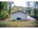 Backyard view shows a detached garage with a concrete driveway and grassy lawn at 1351 Eason Nw St, Atlanta, GA 30314