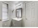 Neutral bathroom with a gray vanity, silver hardware, and decorative wall accents at 1351 Eason Nw St, Atlanta, GA 30314