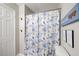 Bathroom with a floral shower curtain and humorous shower-related wall art at 1351 Eason Nw St, Atlanta, GA 30314