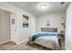 Cozy bedroom with soft lighting, natural textures, and playful Atlanta-themed wall art at 1351 Eason Nw St, Atlanta, GA 30314