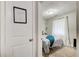 Bedroom featuring wood-look floors, ample light, and comfortable bed with throw blanket at 1351 Eason Nw St, Atlanta, GA 30314