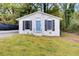 Charming cottage-style home featuring a blue door and arched windows at 1351 Eason Nw St, Atlanta, GA 30314