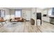 Open living space with hardwood floors connected to a modern kitchen at 1351 Eason Nw St, Atlanta, GA 30314