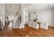 Open-concept with hardwood floors, staircase and dining area with modern chandelier at 1462 Valley Glen Way, Dunwoody, GA 30338
