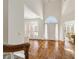 Bright foyer showcasing hardwood floors, high ceilings, and an arched entryway with natural light at 1462 Valley Glen Way, Dunwoody, GA 30338