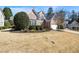 Brick home featuring a well-manicured lawn and attached two car garage in a desirable neighborhood at 1462 Valley Glen Way, Dunwoody, GA 30338