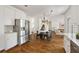 Eat-in kitchen features stainless steel appliances, granite countertops, and hardwood floors at 1462 Valley Glen Way, Dunwoody, GA 30338