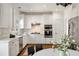 Bright kitchen featuring white cabinets, stainless steel appliances, and granite countertops at 1462 Valley Glen Way, Dunwoody, GA 30338