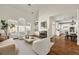 Spacious living room with fireplace, hardwood floors, and large windows providing ample natural light at 1462 Valley Glen Way, Dunwoody, GA 30338
