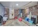 Unfinished basement with brick walls, cement flooring, and a door to the outside at 224 E Felton Rd, Cartersville, GA 30121