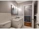 Clean bathroom features a standard toilet, tiled walls, and a vanity with lots of light at 224 E Felton Rd, Cartersville, GA 30121