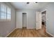 Bedroom with hardwood floors, closet, and window with plantation shutters at 224 E Felton Rd, Cartersville, GA 30121