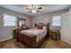 Comfortable bedroom with hardwood floors, ceiling fan, and well-lit windows at 224 E Felton Rd, Cartersville, GA 30121