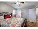 Bedroom features a ceiling fan, hardwood floors, and easy access to an ensuite bathroom at 224 E Felton Rd, Cartersville, GA 30121