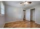 Clean bedroom with ceiling fan, hardwood floors, and closet at 224 E Felton Rd, Cartersville, GA 30121
