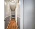 Hallway featuring hardwood floors, two-tone walls, and overhead lighting at 224 E Felton Rd, Cartersville, GA 30121