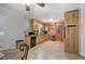 Cozy kitchen with light wood cabinets, tile floors, and granite countertops at 224 E Felton Rd, Cartersville, GA 30121