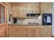 Detailed view of the kitchen featuring wood cabinets and granite countertops at 224 E Felton Rd, Cartersville, GA 30121